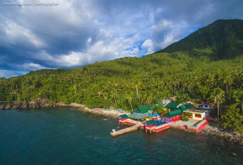 an aerial view of a house in the water at Napo Beach Resort in Maripipi