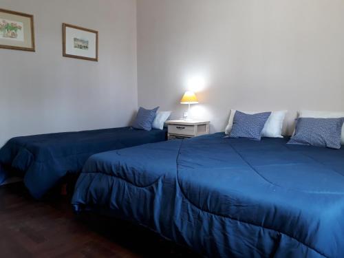 Una cama o camas en una habitación de Casa Flandes - Jáuregui - Luján - Buenos Aires
