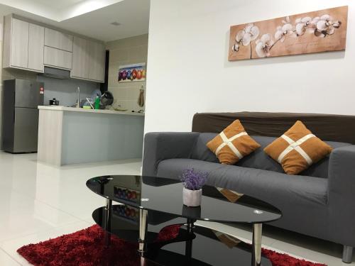 a living room with a couch and a table at Splendid Suite 2 Bedroom @ Sunway & PJ in Petaling Jaya