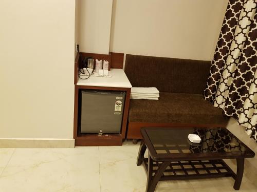 a living room with a couch and a coffee table at Hotel Banaras Haveli in Varanasi