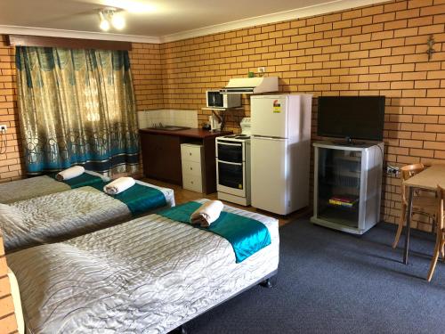 Η κουζίνα ή μικρή κουζίνα στο Stockman Motor Inn