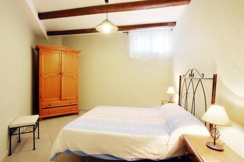 Un pat sau paturi într-o cameră la La Bodeguita