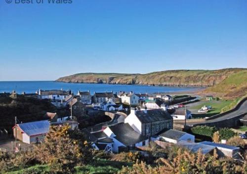 a small town next to a body of water at Bwthyn Carreg in Aberdaron