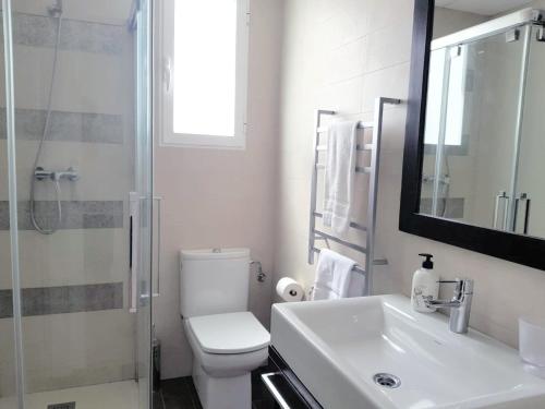 a bathroom with a toilet and a sink and a shower at FLORIT FLATS - The Jardines del Turia Apartment in Valencia