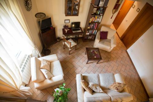 an overhead view of a living room with two white couches at Bed & Breakfast Il Bargello in Florence