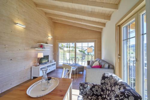 a living room with a couch and a table at Alb Appartements in Albstadt