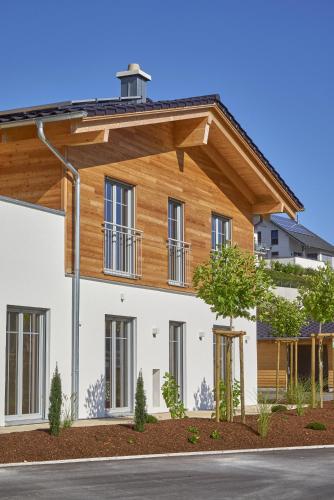 a house with a wooden roof at Alb Appartements in Albstadt