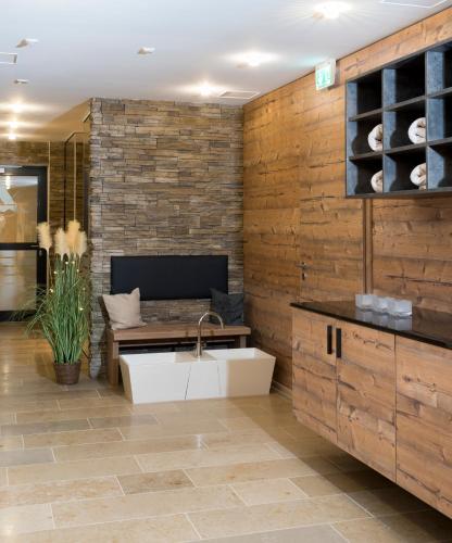 a kitchen with a sink in the middle of a room at Landhotel Zum Adler in Oberbechingen
