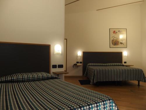 Postel nebo postele na pokoji v ubytování Hotel Eden
