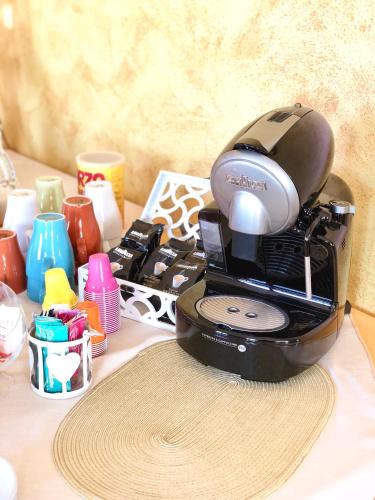 a coffee maker sitting on top of a table at Villa Aurora in Villanova del Battista
