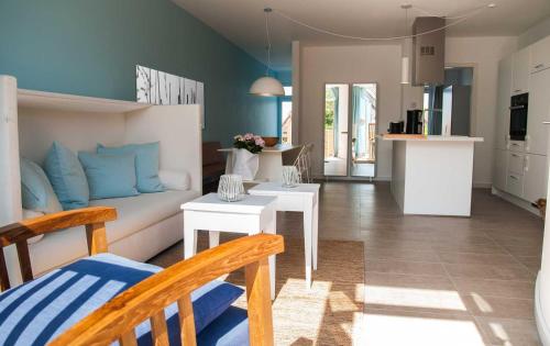 a living room with a couch and a table at Lotsenstieg 2 Kajuete 05 in Ostseebad Karlshagen