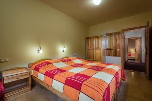 A bed or beds in a room at Guest House Privat Pod Lesom