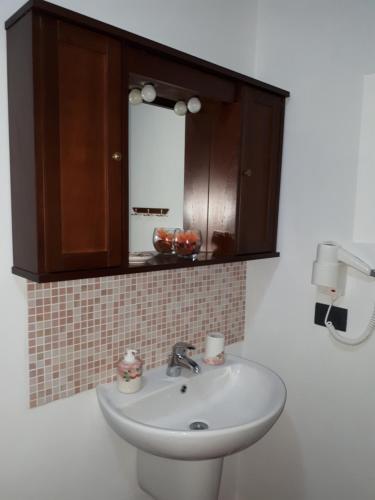 a bathroom with a sink and a mirror at B&B collina e mare in Camogli