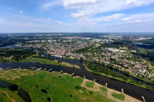 an aerial view of a city next to a river at LAT Hotel & Apartmenthaus Berlin in Eisenhüttenstadt