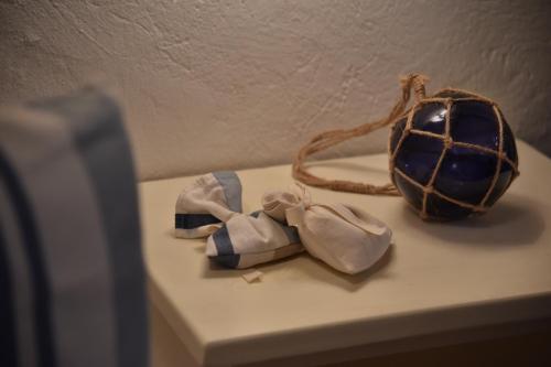 a table with two bow ties and a ball on it at Talacchio in Città di Castello