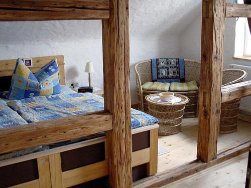 a bedroom with two bunk beds and a couch at Wellness-Fewo Lindner in Erlau