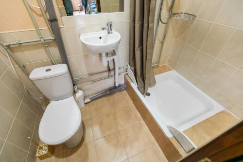 a small bathroom with a toilet and a sink at Hostel Bed&Bread in Dnipro