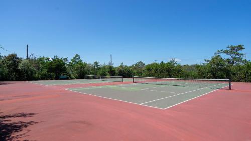 a tennis court with a net on top of it at Sea Crest in Amagansett