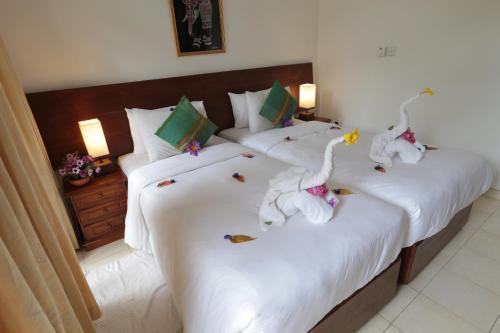 Cama ou camas em um quarto em Sandul Villa