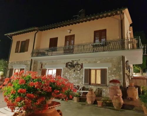 a house with flowers in front of it at B&B I Coppi in San Gimignano