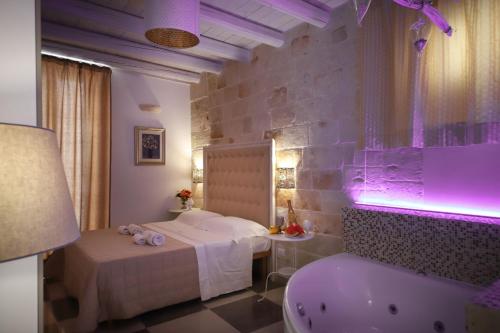 Letto o letti in una camera di HolidayMonopoli