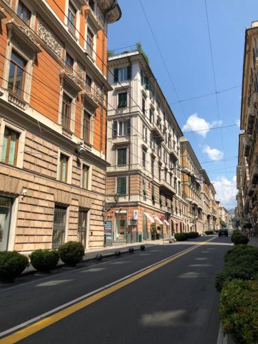 an empty street in a city with buildings at B&B Genova Centro in Genova