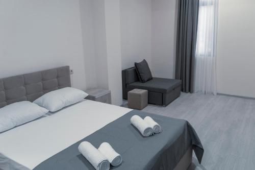 Postel nebo postele na pokoji v ubytování Avlabari Terrace Rooms