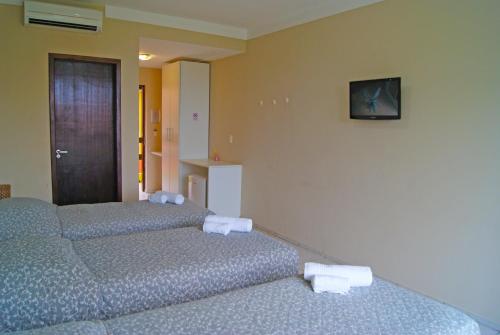 Katil atau katil-katil dalam bilik di Moriah Natal Beach Hotel