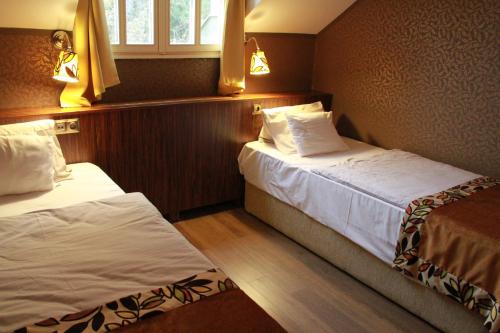Villa Székely tesisinde bir odada yatak veya yataklar