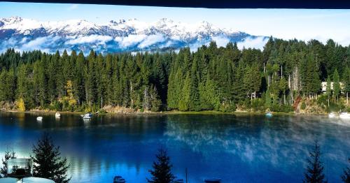 a view of a lake with mountains in the background at Marinas Alto Manzano in Villa La Angostura