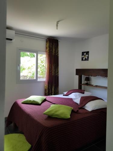 Tempat tidur dalam kamar di Jardin D'eden