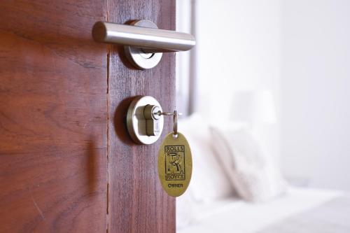 a lock on a door with a tag on it at Villa Santé by The Serendipity Collection in Kalpitiya