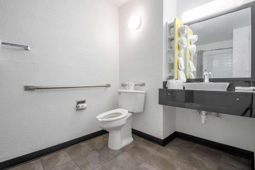 a bathroom with a toilet and a sink at Motel 6-Norcross, GA - Atlanta Northeast in Norcross