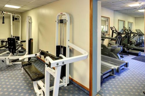 a gym with treadmills and elliptical machines at Passage House Hotel in Newton Abbot