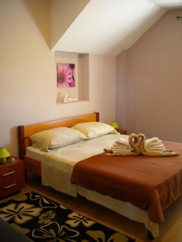a bedroom with a bed in a room at Apartments Vito in Nin