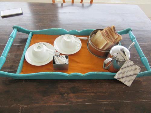 a tray with plates and utensils on a table at Devra Udaipur in Udaipur