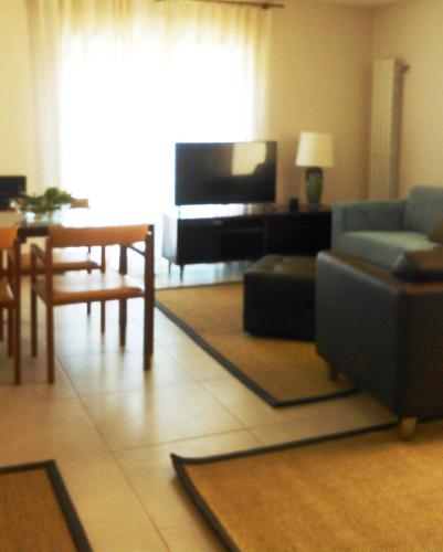 a living room with a couch and a table at Alto Belo in Felgueiras