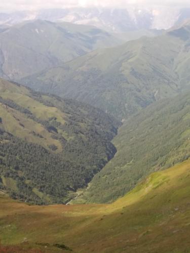 a view of a valley with mountains in the background at Marina's guest house in Lentekhi