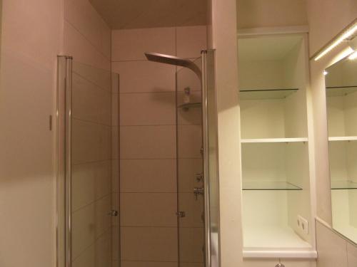 a shower with a glass door in a bathroom at Hof Berens in Hövelhof