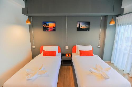 Postel nebo postele na pokoji v ubytování 7 Days Premium Hotel Pattaya