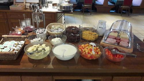 a table topped with lots of different types of food at Apart Felsenhof in Längenfeld