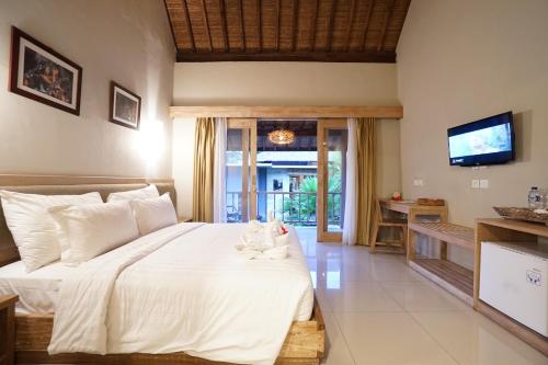 Katil atau katil-katil dalam bilik di Tetirah Boutique Hotel