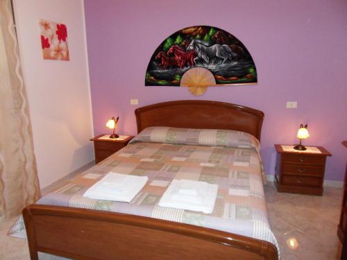 Säng eller sängar i ett rum på Villetta Girasole