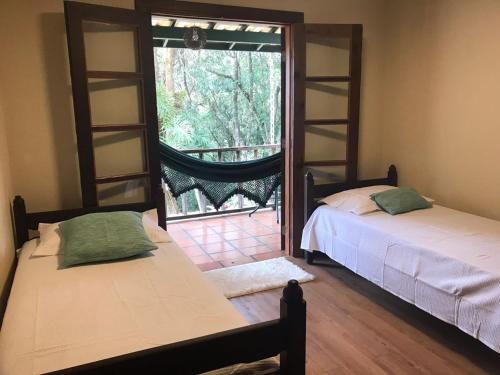 Postel nebo postele na pokoji v ubytování Paz e Aconchego.