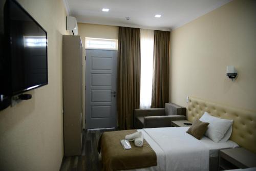 TV a/nebo společenská místnost v ubytování Hotel New Avlabari