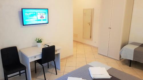 Un televizor și/sau centru de divertisment la Dodo Holiday in Rome