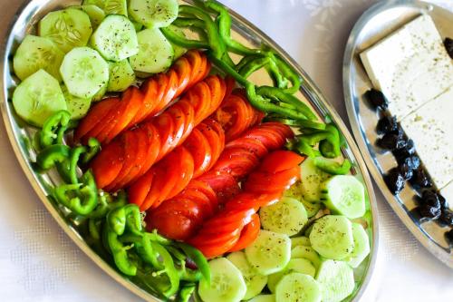 a plate of carrots and vegetables on a table at Philoxenia Hotel in Skala Prinou