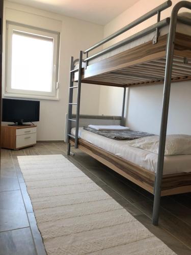 Posteľ alebo postele v izbe v ubytovaní Harmony VIR Luxuriös ausgestattete Ferienwohnung mit 65m2