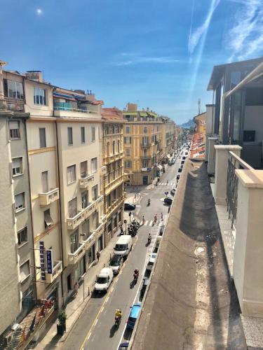 a view of a city street with cars and buildings at Maison Beaux-Arts in Sanremo