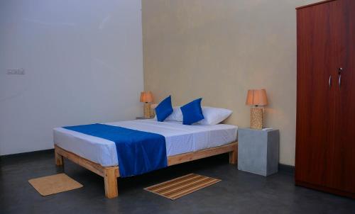 Postel nebo postele na pokoji v ubytování Hotel Star White - Negombo